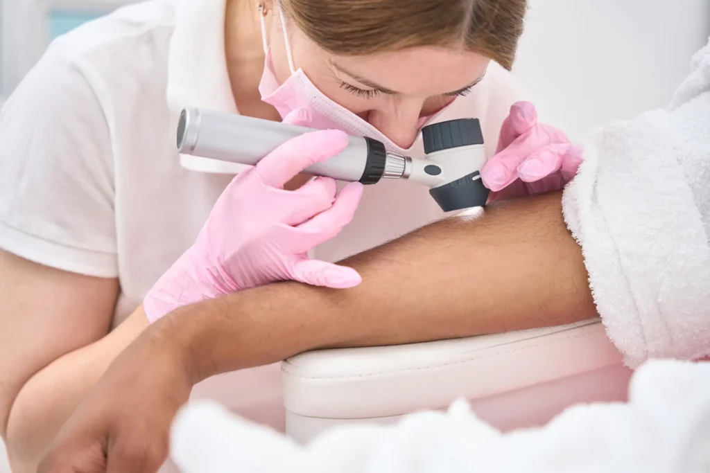 Skin cancer screening being peformed by a Dermatologist